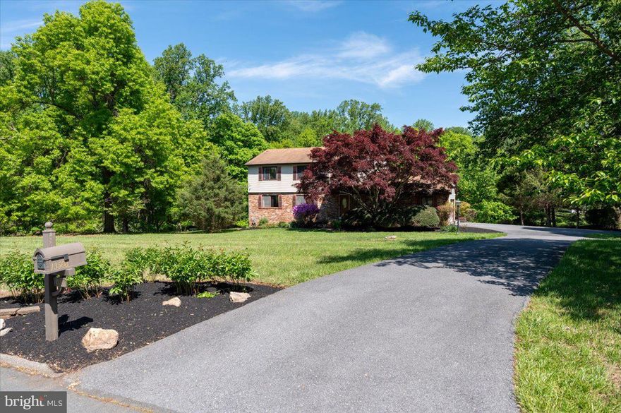 Beautiful home on a private, spectacular 1.83-acre lot. The family room features a cathedral ceiling, and the spacious kitchen offers upgraded maple cabinets, a large island, and Silestone countertops. Three fireplaces and classic details throughout, with generously sized rooms and excellent closet/storage space. Finished walkout lower level includes an office and additional living space. Sold as-is, but in good condition. Updates: HVAC (2024), water heater (2025), dishwasher (2026), water softener (2023), well pump (2021), and garage door (2020).