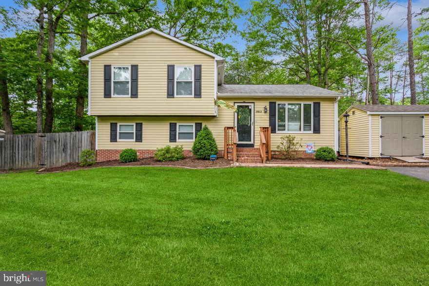 Beautiful split level in the Cobblestone neighborhood. Hardwood floors throughout the main level and bedroom level. Walk into the spacious living room which flows naturally into kitchen and dining.  Three bedrooms and full bathroom upstairs. Cozy downstairs walk-out basement with full bathroom and utility room.  Roof (2010), updated windows. Front door and storm door will be replaced in the next few days.  Large deck overlooking a private, sizeable, level backyard perfect for gardening and entertaining with 8x10 storage shed. You don't want to miss this one!