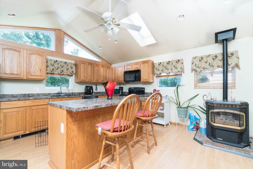 Incredibly large home with oversized Kitchen with Cathedral Ceilings and skylights. Living room,3 bedrooms and bath compliment the main floor with double sliders leading to deck and expansive  fenced rear yard. The lower level boast family room, bar area, laundry room, full bath and workshop. Great curb appeal with fenced front and driveway. Owner has found home of choice.