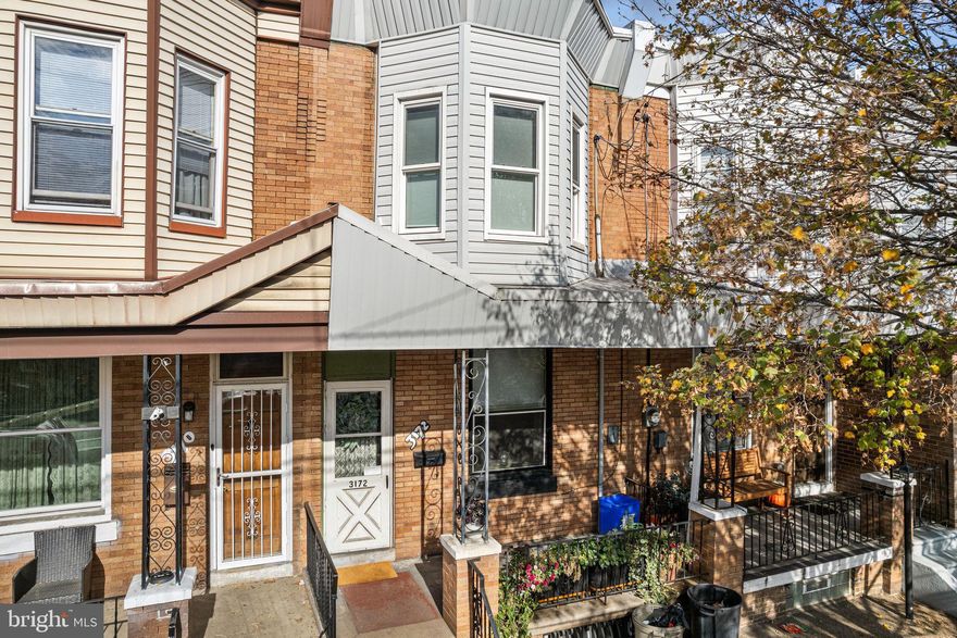 Now’s your chance to own a timeless Philadelphia rowhome in the heart of Port Richmond! This classic home features a brick facade and a welcoming front porch that leads into a charming foyer, complete with wainscoting and the perfect spot to kick off your shoes. Step inside to discover the spacious living and dining area, where gleaming hardwood floors with Celtic knot inlays flow throughout, complemented by a cooling ceiling fan and a large window that fills the space with natural light. Continue into the stunning, newly renovated kitchen (2022), featuring granite countertops, rich custom designed hardwood cabinetry offering abundant storage, stainless steel appliances, a stylish tile backsplash, and durable ceramic tile flooring. Efficiently designed for everyday living and entertaining alike, this kitchen is a dream for any home chef. Upstairs, you’ll find three generous bedrooms, each thoughtfully designed with comfort in mind. The primary suite is a standout, showcasing a bow window that floods the room with light and a walk-in closet. A well-appointed hall bath serves all bedrooms. Back on the main level, an updated laundry/mudroom leads to the spacious fenced yard and your private urban oasis. There’s ample room for grilling, outdoor dining, and gardening, creating the ideal setting for relaxing or entertaining. This home has been meticulously maintained with numerous upgrades, including a newer heater and hot water heater (2022) and updated electric (2022). Conveniently located near local favorites like Tacconelli’s Pizza and Stock’s Bakery, plus an array of neighborhood bars, restaurants, and shopping. Easy access to I-95 makes commuting into Center City a breeze with just a 20 minute commute by car. Don’t miss the opportunity to make this beautifully updated Port Richmond gem your new home. Schedule your showing today before it’s gone!