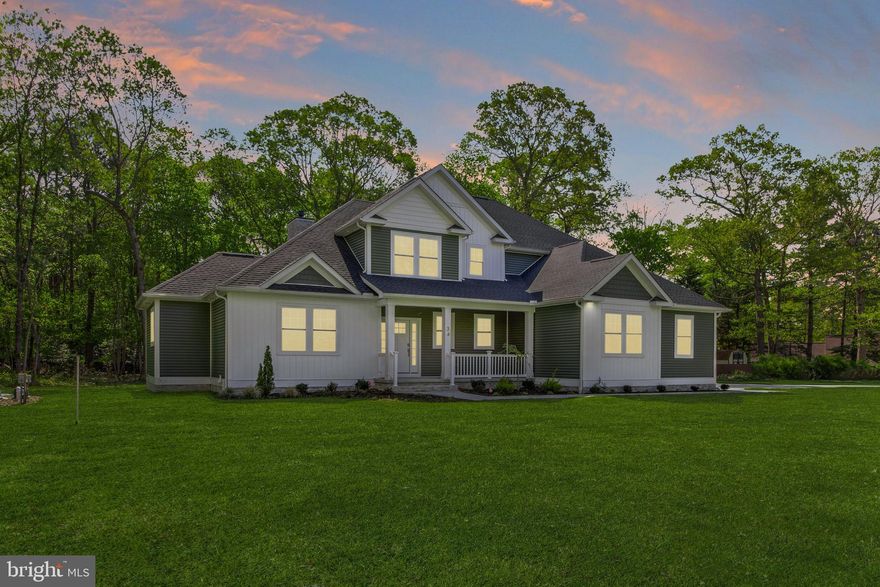 Discover the perfect blend of quality craftsmanship and modern convenience in this beautifully designed 2-story home in the sought-after community of River’s End, set on a private 1-acre lot surrounded by mature trees. Built by Dabar Home Builders, this thoughtfully designed residence offers an open-concept layout with soaring ceilings, abundant natural light, and durable luxury vinyl plank flooring throughout.

The gourmet eat-in kitchen serves as the heart of the home, featuring quartz countertops, Kraftmaid soft-close cabinetry with pull-out drawers, a large center island, walk-in pantry with built-ins, and GE stainless steel appliances including a 5-burner gas cooktop and double ovens. It flows seamlessly into the dining area and spacious living room, where double-stacked windows and a cozy gas fireplace create a bright, inviting space for everyday living and entertaining.

The main-level owner’s suite offers a private retreat with a tray ceiling, custom walk-in closet, and a spa-inspired bath complete with dual quartz vanities, a tiled walk-in shower with rain head and bench, and a freestanding soaking tub. A private office with French doors, mudroom with built-ins, and powder room complete the main level.

Upstairs, a versatile loft provides additional living space along with three generously sized bedrooms, including one with an ensuite bath, plus a hall bath.

Situated on nearly an acre, this property delivers the space and privacy today’s buyers seek, without the wait or added expense of new construction. Outdoor features include a covered front porch, paver patio and walkway, irrigation system, and a finished side-entry 2-car garage. Additional upgrades such as a Rinnai tankless water heater, conditioned crawlspace with dehumidifier, and dual sump pumps add comfort and peace of mind.

Located in a quiet community along Deep Creek with a pond and picnic area, and convenient access to Route 13, this move-in ready home offers exceptional value with everything already complete—no delays, no surprises, just an easy transition into your next chapter.