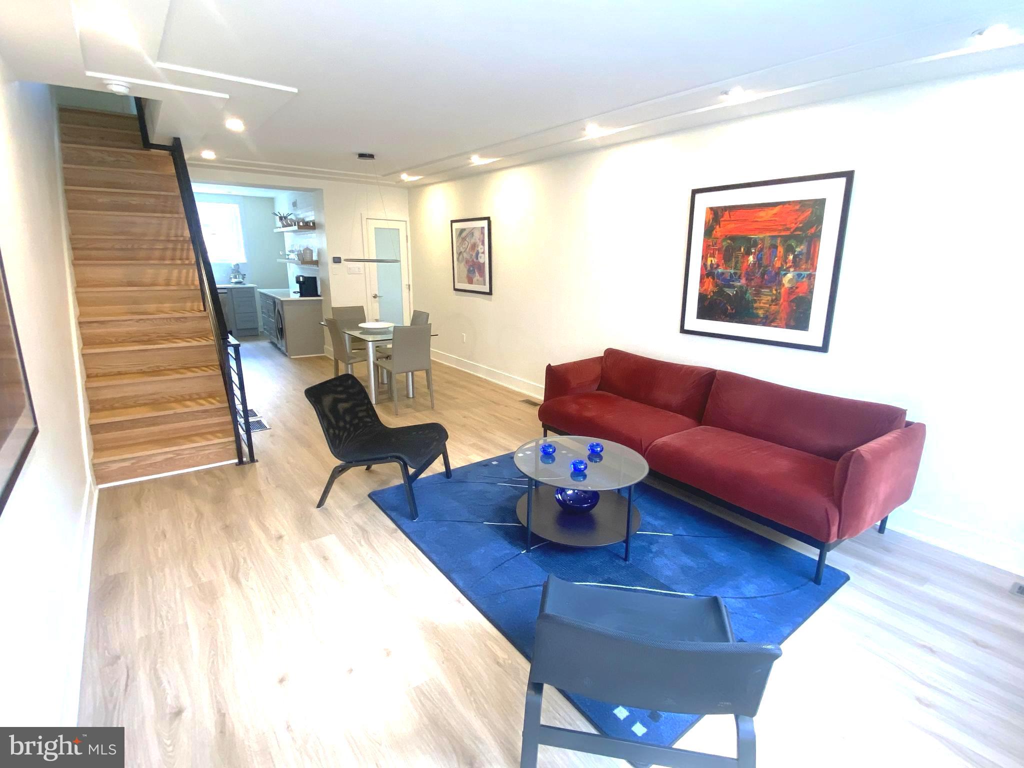 Welcome to 2441 S Clarion Street. A very special modern high-end renovation. The House was stripped down to the studs and joists. New HVAC, Plumbing, and Electrical. A complete and total modernization. Open, spacious 1st floor plan. Unique molded ceiling and lighting in the living and dining areas. A half bath is located off the dining room. Cook's Kitchen features smart appliances, a Beverage Refrigerator, a Convection/Air fryer drop-in range, Tiled walls, floating shelves, and hidden under-cabinet receptacles. The kitchen is complemented by under and over-cabinet LED lighting. The space is completed with a built-in spice cabinet. Enlarged stairwells with new steps. The second floor features two bedrooms, each with a spacious, well-lit closet. Also, there's a closet in the hallway. Contemporary, spacious European-style tiled Bathroom. With double showers and a double sink vanity. Large lit mirror and a built-in closet. The lower level is a large, open space with a Utility Room, a laundry room, and a coat closet. All ductwork is hidden in walls, even in the Lower level, with no soffits, just open space. Only a few blocks from Passayunk Ave. Easy Walk to subway and public transportation. This house must be viewed in person to be truly appreciated.