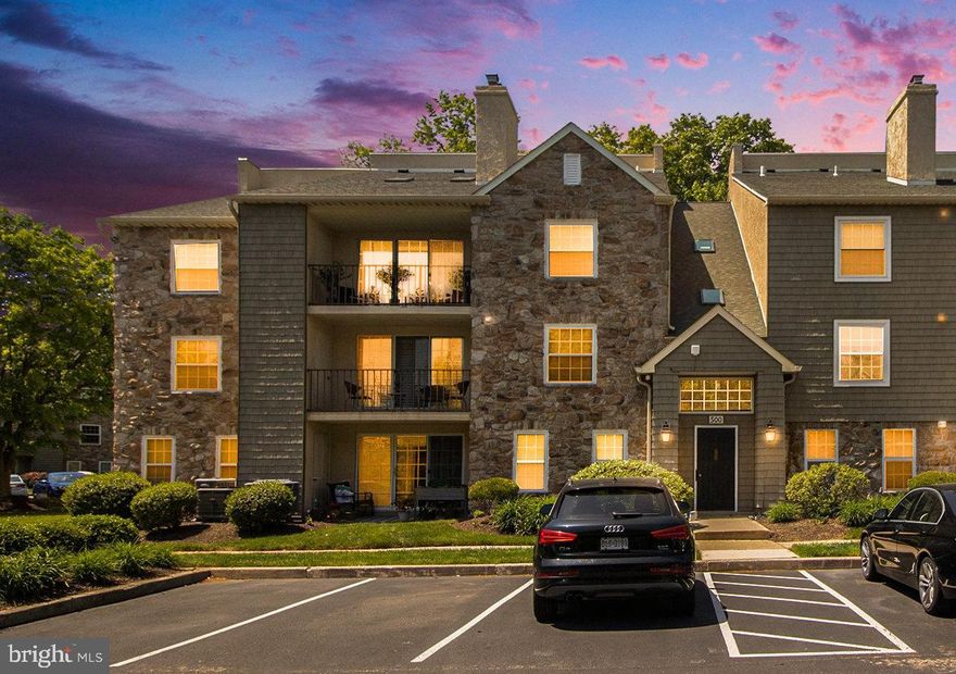 Welcome to 505 Deer Run, a pristinely maintained and beautifully updated move-in ready home.  Easy living is simply waiting for you!  Located in the Deer Run community, this 2nd level flat has a secured entrance with brand new keyless entry allowing you to buzz in guests or a delivery from a convenient phone app.   A foyer with tile floors and double coat closet leads into a spacious open floor plan ideal for living and entertaining.  Entire home has neutral paint, 6 panel interior doors and Berber carpet in the living areas.   The dining room provides plenty of space for a table and chairs while the adjacent living room has a handsome wood burning fireplace with a custom wood mantle and whitewashed brick hearth and surround.  Floor to ceiling sliding plantation shutters access a deep covered porch waiting for you to unwind.  Notice the attention to detail given to the kitchen - raised panel white cabinetry with an appliance garage, glass front accents, brushed nickel hardware, crown and bead board accenting the bar area.  Dark granite look laminate counters provide a beautiful contrast.  There's recessed and pendant lighting, ceramic tile floors, a stainless steel sink with disposal,  Moen faucet with sprayer and a tiled backsplash.  All black Kenmore appliances - dishwasher, built-in microwave, smooth surface electric range and refrigerator.  The split bedroom floor plan allows for more privacy with a beautiful primary suite off the living room including a large bedroom with deep windows, a lovely wall of built-in bookshelves, with woodwork detail to cover your electrical panel, a walk-in closet with custom organizer and a full bath with a stunning custom tiled stall shower, sprayer, and with glass doors, built-in shelving, tile floors, new vanity and a newer Kohler toilet.  The second bedroom is located off of the foyer and has a double closet, berber carpet, floor to ceiling closets  The hallway to this bedroom has a  full bath with tile floor, newer Kohler toilet, vanity and tub with solid surface shower surround.  The large laundry room has a full sized GE washer and Kenmore dryer which is included with the home.  So much has been done to ensure this home is ready for you - Bryant A/C and heater (2019), Bradford White water heater, Honeywell programmable thermostat and even a one year AHS Home Warranty.  The association takes care of lawn, trash, snow removal and exterior maintenance while for a small fee you may also have access to the association pool next door.  This community has an ideal location with easy access to commuting routes and rail, shopping, dining, entertainment and parks. Hurry to make your appointment. Don't miss this wonderful opportunity!