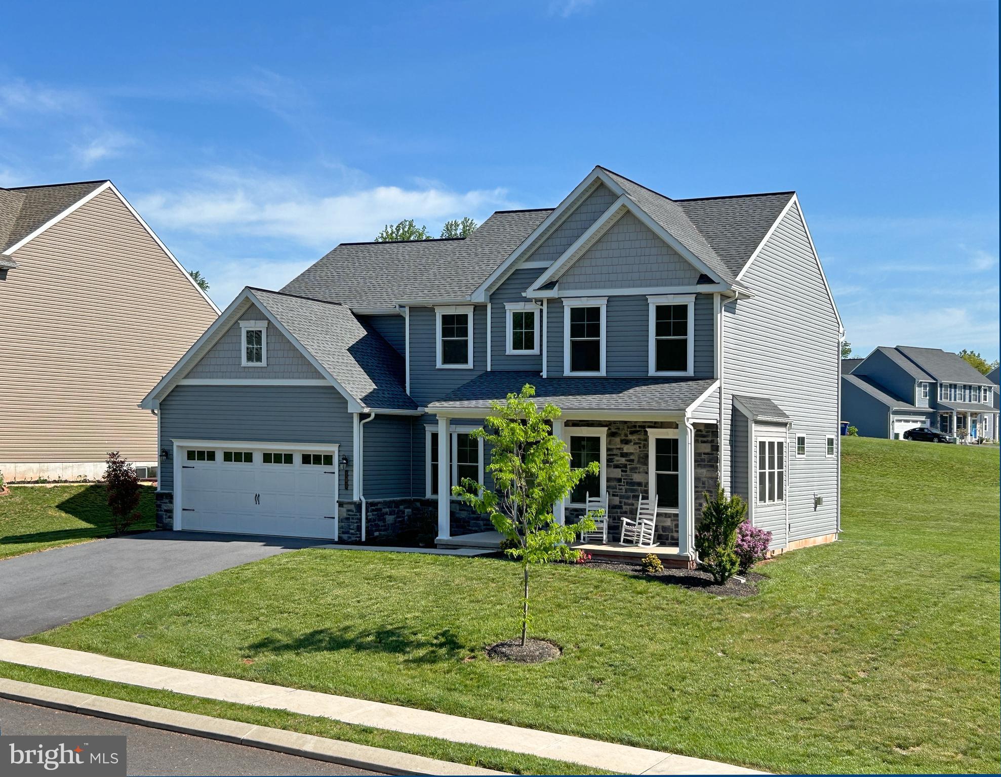 The home you have been admiring is now available! There are so many beautiful features in this Woodland Hills model home and they can be yours without the wait time of a new home build. The Osprey model has 2,898 sq ft with 4 bedrooms and two and a half bathrooms. With ample storage and counter space, the kitchen will be where the family and guests will want to gather. The beautiful granite counters, oversized island and under-cabinet lighting are a few of the custom features that you will enjoy. Soak up the sun all year round in the 12x14 sunroom that is situated just off the great room area. A gas fireplace and built-in bookshelves are the natural focal point of the living room area. Also on the 1st floor is the flex room, study, laundry room, powder room and a mudroom area with a bench seat, coat hooks and lockers. The second floor has 4 larger bedrooms and 2 bathrooms. The master bath, with it's ceramic tile floor, tiled shower and soaking tub, will be your place to retreat and pamper yourself at the end of the day. The hall bath has a tub/shower. The unfinished basement features 9' poured concrete walls. This home is situated on a corner homesite and has easy access to Vine Street and I-283.
This home will be ready for your occupancy in October.