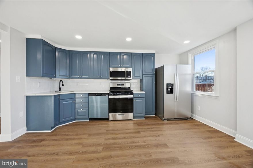 Welcome to 274 N Oak Ave, a beautifully renovated 3 Bedroom row with 2 Full Baths. Walk into the front door and you'll notice the sun filled living room with bay window. The formal dining room's open concept leads into a fully renovated kitchen featuring lovely blue cabinetry, tile backsplash, recessed lighting and new stainless appliances. The 2nd floor features hardwood flooring throughout, recessed lighting, a good sized master bedroom with 2 additional bedroms. The full hall bathroom has been fully renovated with lovely white tile and a modern, neutral decor. The basement has a nice finished space for entertaining with recessed lighting and vynyl plank flooring and the convenient of having a full bathroom. There is a private interior entrace into the living space from the attached garage. Also you will find an outside exit to extra parking and a gated outside yard. Walking distance to schools, churches, shopping and public transportation! A must see! Photos will be posted on the evening of 12/12.