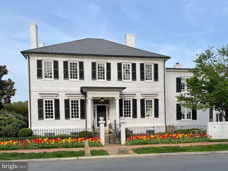 Welcome to 213 Caroline Street, an architectural masterpiece and the oldest remaining original structure on this historic street. Built in 1764, this Georgian-style estate stands as a landmark of American history, once home to Dr. Charles Mortimer, Fredericksburg’s first mayor and a trusted physician to Mary Ball Washington. Steeped in history yet seamlessly updated for modern living, this residence is a rare opportunity to own a true piece of the past. 

Inside, classic 18th-century charm is preserved in every detail, from the original heart of pine floors to the intricately paneled rooms and ornate entablatures. The grand paneled parlor is among the home’s most remarkable spaces, a stunning showcase of handcrafted woodwork that has remained essentially untouched for centuries. This room, once the setting for gatherings of Revolutionary War leaders, truly embodies the home’s rich and storied past. 

Beyond the main residence, the estate offers two additional structures: a one-bedroom, one-bathroom guest house, perfect for visitors or private quarters, and a freestanding building currently designed as a golf simulator room—which could easily be converted into a garage or studio space. Though this is an 18th-century home, it has been thoughtfully modernized with updated electrical and plumbing systems, ensuring 21st-century comfort while maintaining its historic integrity. 

Set on an expansive parcel spanning what would now be five city lots, this special property boasts a rarely found backyard retreat with unobstructed views of the Rappahannock River and Ferry Farm, the childhood home of George Washington. The spacious back porch provides the perfect setting for entertaining or enjoying the tranquil, private surroundings, all while being in the heart of the Downtown Fredericksburg Historic District. 

Blending historic elegance with modern comfort, the home features a sun-filled rear addition with a gourmet kitchen and an inviting family room, designed to capture breathtaking sunset views over the river. Its prime location allows for a short walk to downtown shops, restaurants, and Amtrak’s Northeast Corridor, offering a seamless connection to major cities. 

A true masterpiece of architecture and history, 213 Caroline Street is an extraordinary offering—one of Fredericksburg’s most significant residences, preserved perfectly for the next generation. Please note that the total bedroom/bathroom count includes the main residence (4BR/3BA) and the guest house (1BR/1BA).