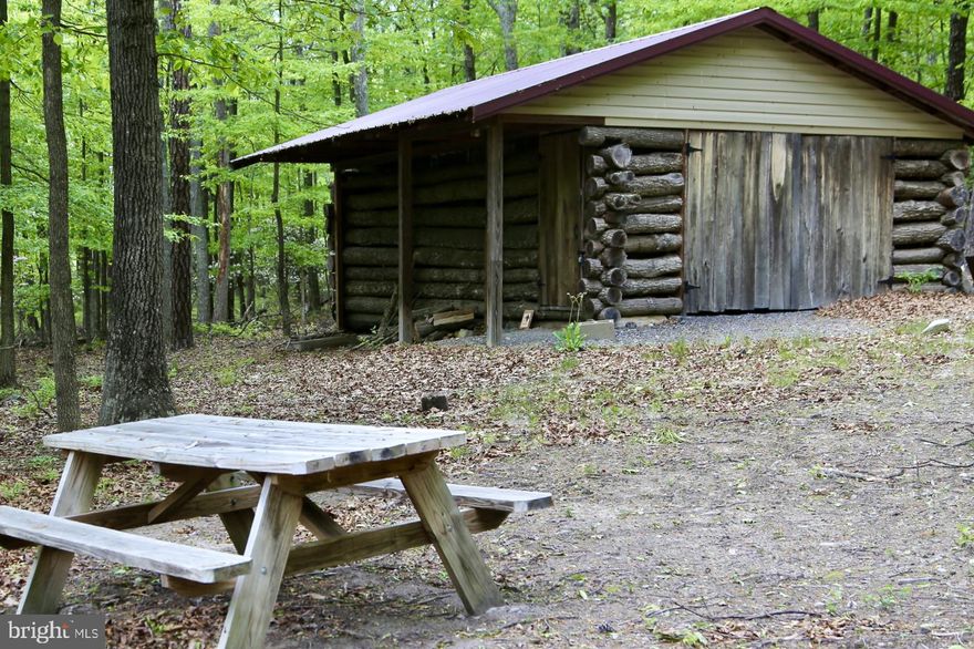 Bring your RV and your dream home plans! This 20.71-acre lot in the gated River Ridge community offers the perfect blend of adventure and serenity—ideal for building your forever home or enjoying right away as a peaceful nature escape.

Tucked behind a secure entrance with well-maintained roads, this property provides privacy, safety, and year-round accessibility. A rustic log structure with electricity already in place serves as a handy storage shed—perfect for stashing your gear, ATVs, or hunting equipment.

An approved Perc report is already on file, giving a kickstart the building process. Whether you're planning a mountain retreat, looking for a private hunting paradise (yes, hunting is allowed in the community), or simply want a quiet place to unplug, this land is ready to deliver.

This is one of the rare parcels in the area offering gently rolling, highly usable terrain—ideal for a variety of uses. The southwestern corner could be selectively cleared to open up beautiful views of the opposing ridge. Lush with native mountain laurel, vibrant wildflowers, and thriving wildlife, the property feels like an enchanted forest

Located just 2 hours from Washington, DC, 30 minutes from Winchester, VA, and only 10 minutes to the charming small town of Wardensville, this property combines convenience with the peaceful seclusion of West Virginia’s "Wild and Wonderful" beauty.

Don't miss your chance to own a slice of Appalachian heaven—call today to schedule your showing!
