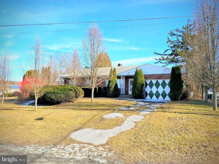 Bring your vision and make this charming 1950s ranch shine! Featuring 3 spacious bedrooms and 1 full bath, this home offers beautiful hardwood floors throughout, a large living room, and a generous dining area. First-floor laundry adds everyday convenience, while the attached 1-car garage and abundant storage make practical living easy. The full basement was once finished and includes a bathroom, offering excellent potential to restore additional living space, a recreation room, or home office. Also included is a 2-bedroom, 1-bath single-wide trailer with attached carport. Ideal for an in-law suite, guest space, or rental income opportunity. The property has been subdivided and surveyed to separate the homes, providing flexibility for future plans.Both homes could benefit from a little TLC, making this a fantastic opportunity for buyers looking to build equity and add their personal touch.