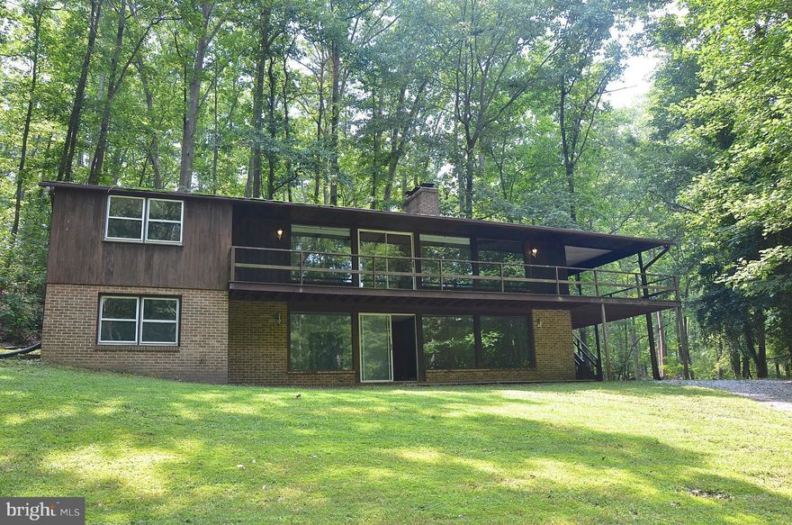 IF IT'S PRIVACY YOU ARE LOOKING FOR YOU HAVE FOUND IT!!   3+ ACRES IN EDGEWATER SITTING TUCKED BACK IN A SERENE, PRIVATE, WOODED SETTING--FEEL LIKE YOU ARE MILES AWAY FROM THE BUSY WORLD--WILDLIFE SURROUNDS YOU--THIS HOME OFFERS MANY POSSIBILITIES--FINISH THE RENOVATIONS OR BUILD NEW--ALSO FIND A TWO-STALL HORSE STABLE WITH TACK ROOM AND STORAGE.   NOT A DRIVE BY--HOUSE SITS WAY BACK!