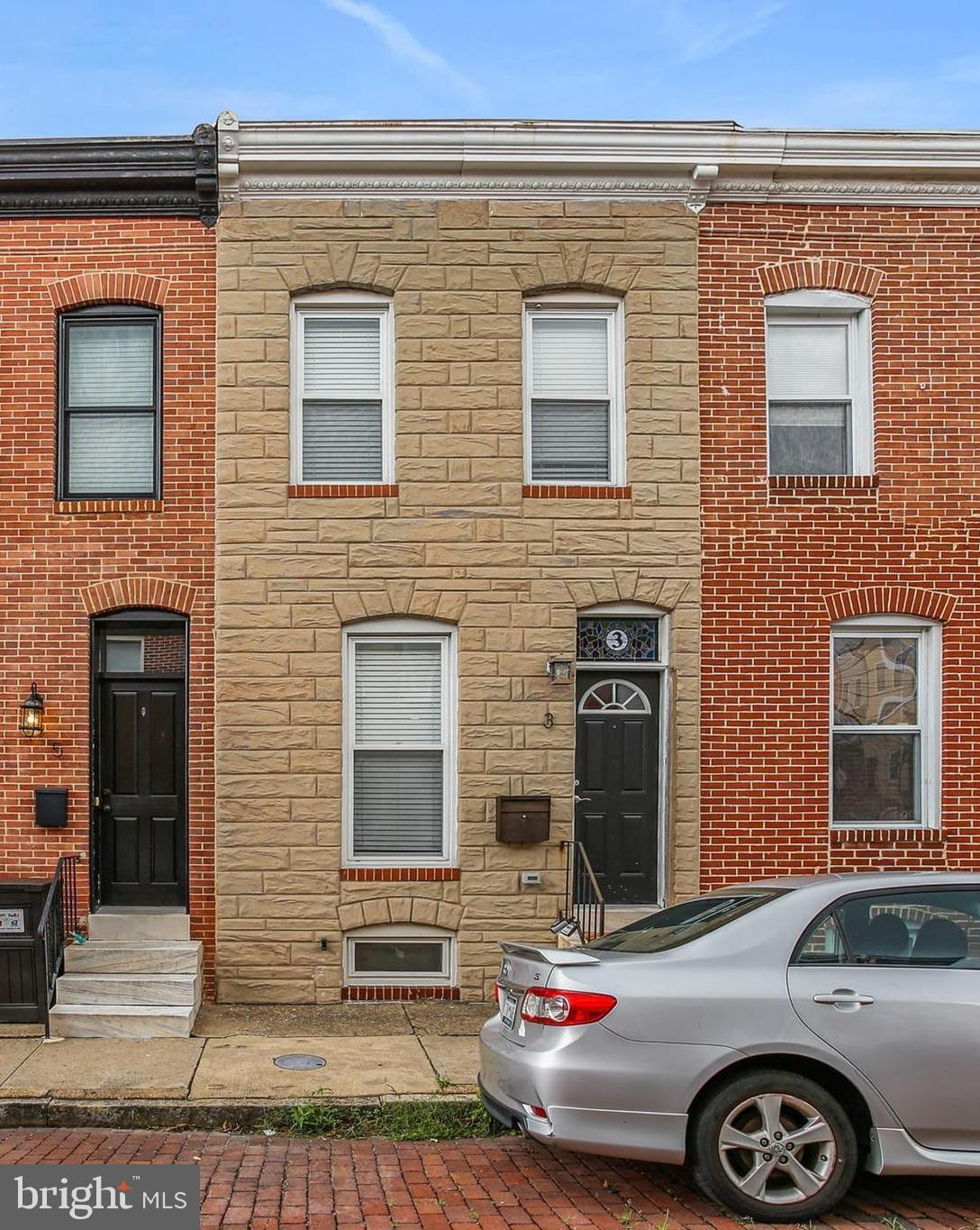 This beautiful two-bedroom and one-and-a-half-bath townhouse with parking pad sits just steps from Patterson Park, offering the perfect blend of historic charm and modern convenience. The sun-filled interior offers a gourmet kitchen with new recessed lighting, sparkling granite countertops, sleek stainless steel appliances, and convenient outside access to the rear parking pad. The main level continues to an open living room and dining room layout with half bath, perfect for guests. The upstairs features a charming skylight that allows ample light to fill throughout. There are two cozy bedrooms, one with convenient laundry with new washer and new dryer, and a full bath with barn style door that rounds-out the upstairs. The unfinished lower level offers ample storage potential and the ability to create the space of your dreams. Perfectly situated just steps from Patterson Park with close access to public transportation, bars, restaurants, the Harbor, Canton and so much more! Don't miss out on this gem!
