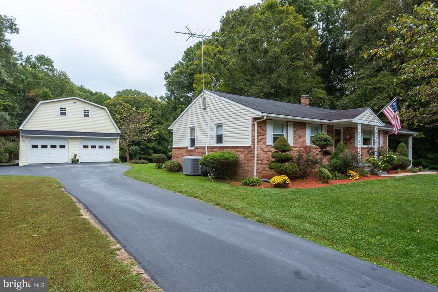 Location, Location, Location! Brick Rambler w/ covered patio on 2+ acres. Nicely landscaped. Finished basement includes BR, full bath, kitchen and family room with sep. entrance.Could be used for a rental or in-law suite. Hardwood floors throughout on main level. Updated kitchen w/granite counters, Detached  2 story workshop 24 X 28 w/ sep.driveway. Includes Riding Lawn Mower & some furniture.