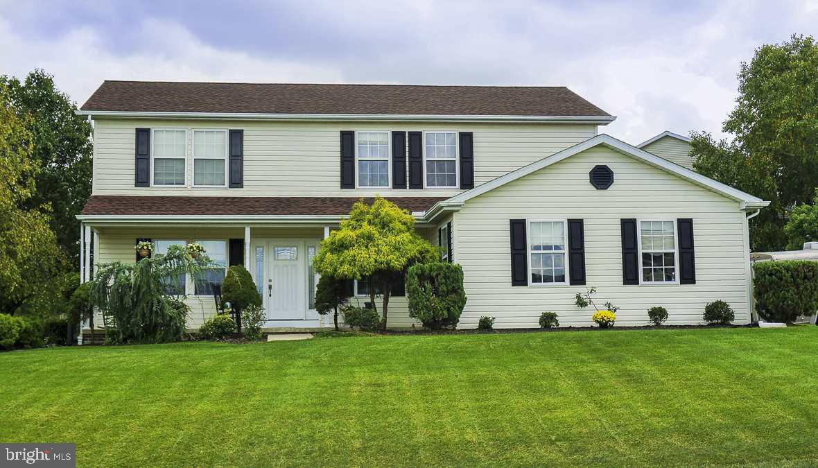 Don't miss this fantastic home situated in Dover Schools on a 1/2 Acre beautifully landscaped corner lot! Great curb appeal with front porch plus rear covered porch! Hardwood floors, Spacious kit w/bkfst bar & built in appliances, dining area, family room with doors to outdoor entertaining area, master suite w/walk-in closet & private bath. 3 additional BR's & guest bath, basement w/walk up to exterior, storage shed, OS 2 car side entry garage!