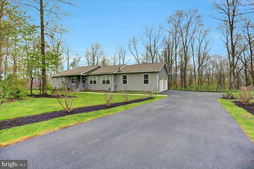 Own a piece of paradise, on this 2 acre peaceful lot.  Meticulously maintained, one floor living at it's best. Ranch home featuring 3 bedrooms, living room, dining room.  Kitchen features a breakfast bar and walk-in pantry.  Six years young. Primary suite features walk in tiled shower and walk in closet.  Full walk out lower level is a fantastic space for growth and expansion as a blank canvas.  Basement features a water softener and radon mitigation system.  Spacious two car attached garage.  Relax and unwind on your trex deck featuring a hot tub and retractable awning.  Property is nicely landscaped.  If interested, seller may be willing to sell some personal property.  Must see property!