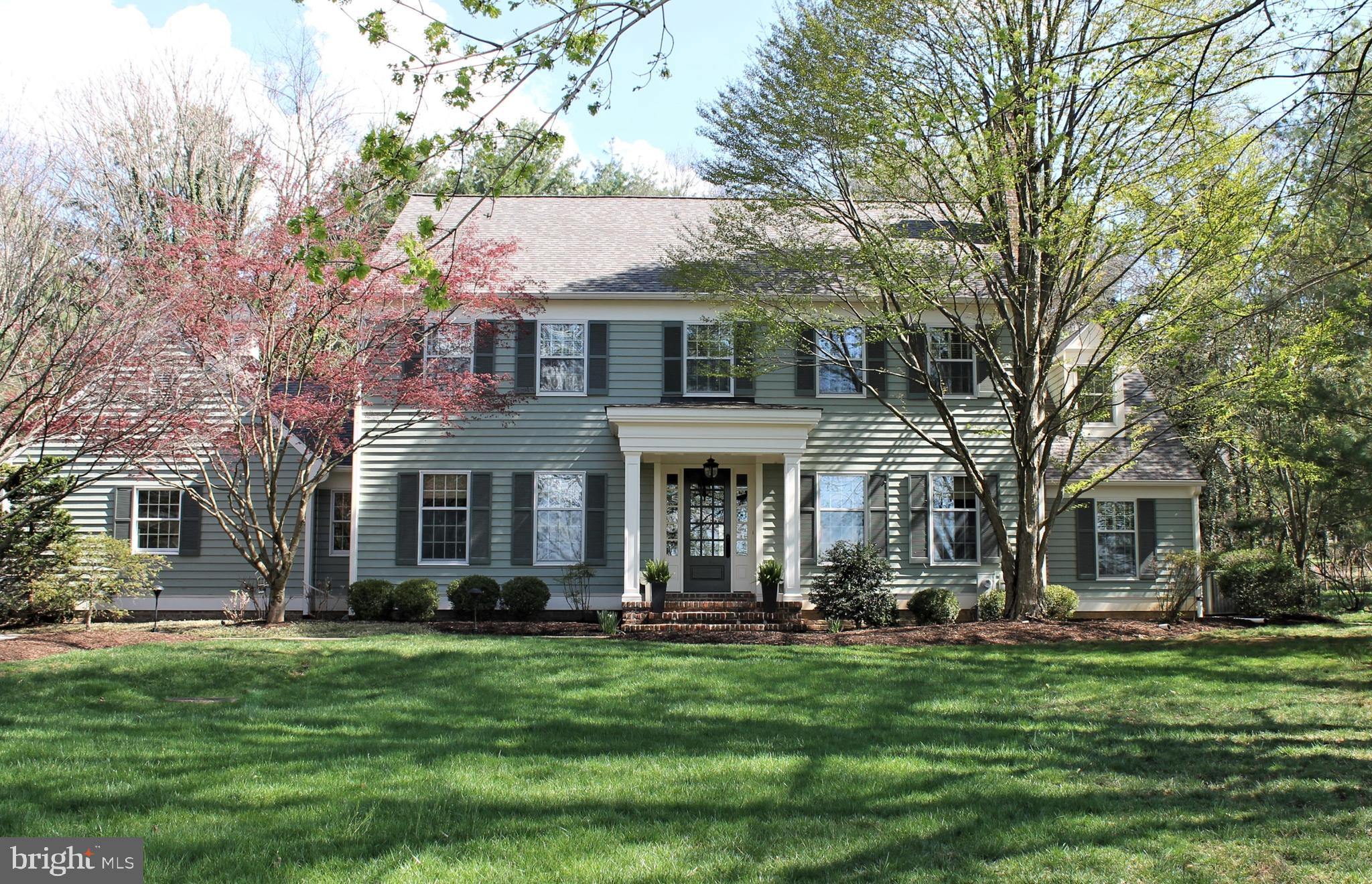 Enjoy the beautiful combination of Sophistication and Elegance found in 1921 West Joppa Road! Smartly situated on a one acre, level, lot, this New England style custom-built home offers just under 5000 square feet of finished living area, with spacious rooms, and loads of flexible living spaces; including two home studies, ideal in today’s virtual, work-from-home, environment. The bright, airy foyer welcomes you in where you’ll find 9 foot ceilings, crown moldings, hardwood floors, and loads of custom built-in features. The traditional floor plan includes a gracious living room with a wood burning fireplace and French doors that open from the foyer to the formal dining room. The kitchen has been thoughtfully updated, with quartz counters, gas cooktop, a double wall oven and a separate wet bar with glass front display cabinetry. Enjoy your morning meals in the sun-filled breakfast area, complete with a wall of windows and three skylights, bringing in all that lovely natural light. A second back staircase from the kitchen leads to second floor. Conveniently located between the garage and the kitchen, you’ll find the newly updated laundry/mud-room and powder room, with black Brazilian Montauk slate flooring, upscale lighting and fixtures chosen to flow with the rest of the home. The main floor study has built-in bookshelves, French doors to the enclosed sun room, and high ceilings that open up above to the primary bedroom’s private study. The spacious family room features a brick wood-burning fireplace, flanked by two sets of glass doors leading to the stone patio. French Doors from the Family Room also lead to the enclosed sunroom, which could be used as an art studio, or yoga studio or exercise room. The upper level features four generous bedrooms. Two of the bedrooms share a buddy bath. The primary bedroom and one of the other bedrooms are both ensuite. All three bathrooms have been freshly renovated with timeless simplicity in mind, glossy white porcelain marble walls and floors, quartz counters, beautiful lighting and high-end fixtures. The primary bedroom features two walk-in closets, and a private study, with railing overlooking the main floor office below. The primary bathroom features a free-standing soaking tub, and glass enclosed shower. The lower level features a large recreation room, a temperature /humidity controlled wine room, a full bath, and a bonus room, which could serve as another guest bedroom. Impeccably maintained, please refer to the owners' notes for a complete list of updates. First showings will be Saturday, April 17, 2021.