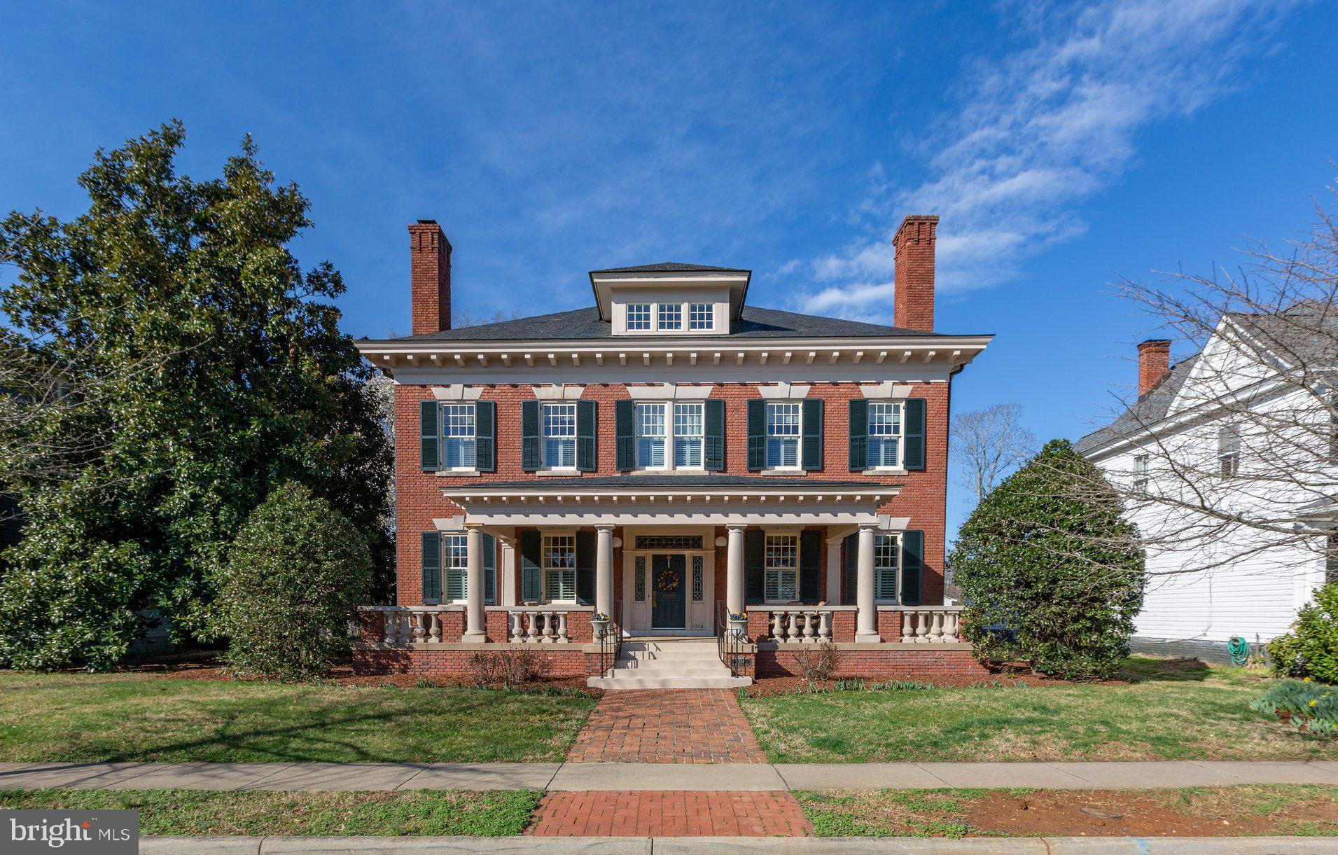 A rare opportunity to "Live on the Avenue" in one of downtown Fredericksburg's finest and most distinguished homes. Originally built in 1910 and meticulously rebuilt in 2001, this home blends historic charm with modern convenience.
Inside, grand hallways, soaring ceilings, rich hardwood floors and elegant dentil crown moldings create an immediate feeling of the quality you'll enjoy throughout. The chef’s kitchen features a new Forno eight-burner range with double oven (2024), a full refrigerator (2025), and a Subzero two-drawer freezer. The adjacent hearth room, with a cozy fireplace and floor-to-ceiling windows, offers stunning views of downtown and the University of Mary Washington.
Four levels of living space are easily accessible via an elevator. The primary bedroom features a private balcony and spa-like en-suite. Two additional bedrooms have en-suite baths, and a partially finished basement offers entertainment space and storage.
Set on 0.89 acres, the home features lush landscaping and a spacious front porch. Updates include a five-zone HVAC (2024), renovated built-in gutters (2024), exterior paint (2024), and Trex decking (2024). A timeless estate in a prime location—don’t miss this rare find.
Proof of funds and/or a letter of qualification from a financial institution is required - no exceptions.