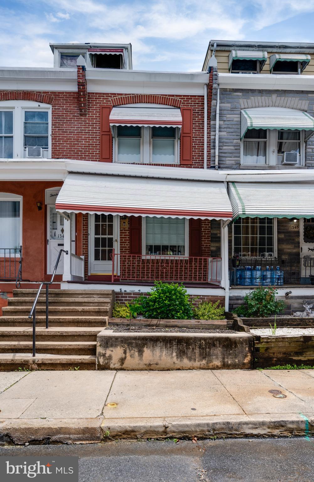 Loved by the same family for 70 years! Yes, you read that right. This home has been incredibly cared for and updated along the way. A welcoming porch invites you to stop and take a seat; you'll hear the school bells from nearby Northeast Middle School. The main floor has a powder room addition and a beautiful kitchen with stainless steel appliances, double sink, garbage disposal, gas cooking and pantry. A mud room inside the back door is perfect to drop your shoes, back packs or possibly a main floor laundry location. The living and dining room are nice size. Upstairs is an updated bath with walk in shower and three bedrooms. An unfinished attic provides plenty of storage. And yes, you have your own garage with opener. Come and see and make it your home for many years, too.