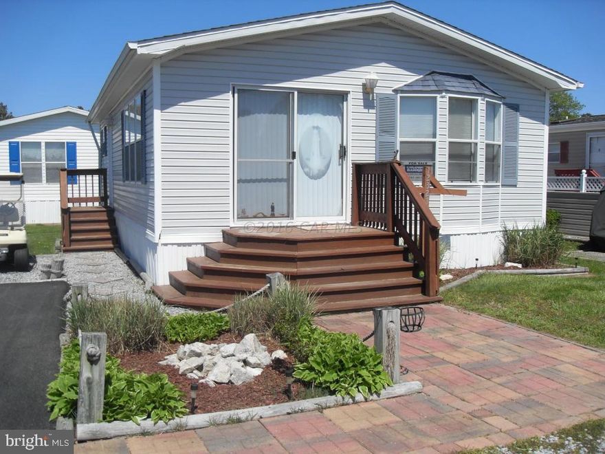 JUST REDUCED $4000!!! This wonderful gated community is a perfect beach getaway!! This active community boasts 2 community pools with clubhouse; one with activities for kids, the other has crab feasts, dances, and more. There is a lake for fishing and paddle boats/canoes. An awesome community pier to the bay and area to store your boat or RV. This is a social community where everyone is family. Located close to Frontier Town and Assateague State Parks. Ocean City and beaches just minutes away! Tired of renting and the high costs to go to the beach? This is the perfect place for you. This home is furnished with 2 bedrooms, 1 full bath, kitchen, eating area, living room, storage shed & picnic area. Newer roof and new paved park pad. Home warranty included.