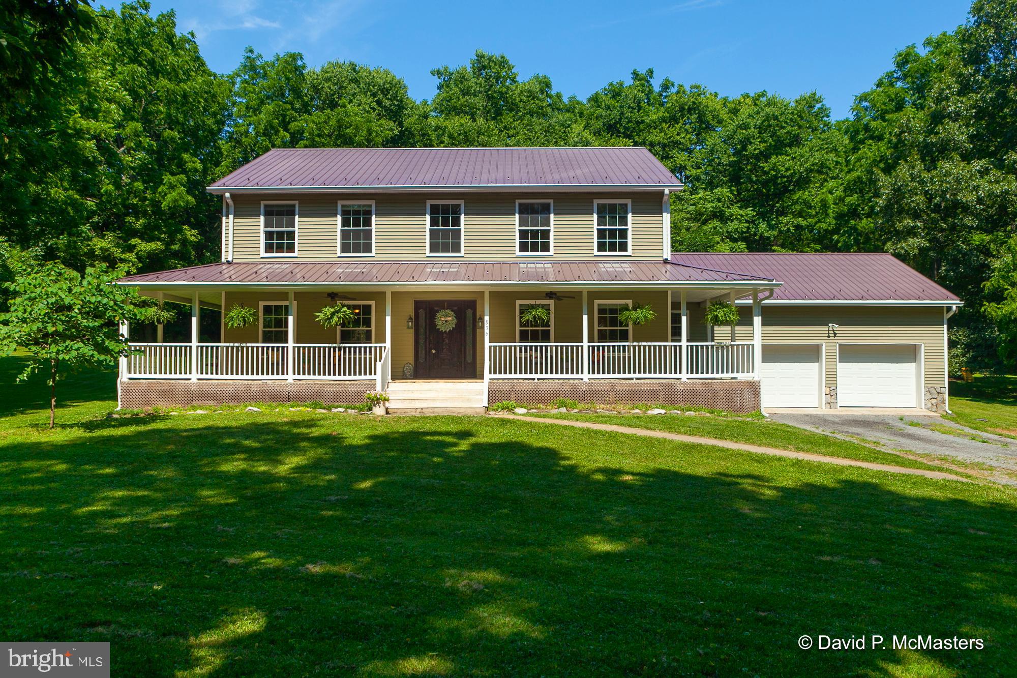 PRICE ADJUSTMENT! Nestled on 2.89 acres of open and wooded land in a river community, this charming two-story home offers four bedrooms and 2.5 baths, blending elegance and comfort. The welcoming wrap-around porch sets the stage for relaxation and outdoor enjoyment, while the attached 2-car garage provides ample storage and convenience. Inside, the home features wider-than-normal stair treads for added safety and accessibility, leading to a spacious second-level family room perfect for gatherings and 3 bedrooms. The main level boasts an open floor plan with a modern galley kitchen, seamlessly connecting to the dining and living areas. The primary bedroom, also on the main level, offers a private retreat with an ensuite that includes a separate shower, tub, and double sinks. This home perfectly balances indoor and outdoor living, which provides a children's play area, a fenced-in garden, and a shed along with access to community river amenities, ideal for those seeking a serene yet vibrant lifestyle.