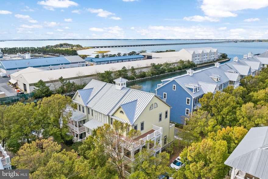 Welcome to 33 Island Edge Drive, a truly exceptional home that has been meticulously maintained by its original owner since its construction in 2003. This stunning 4-bedroom + den / 4.5-bathroom townhome is being offered for sale fully furnished, with only a few exceptions. It is now ready for your family to make it your own. Whether you envision it as your cherished second home, a delightful vacation retreat, or a savvy investment property, you are sure to be captivated by its charm.

Upon entering, you will be greeted by a wrap-around front porch.  This home is 1 of only 19 other homes, in Sunset Island, with triple wrap around porches and balconies on both front & rear.  It also comes with an array of impressive features, including granite countertops, tasteful tile flooring, a spacious back deck perfect for alfresco dining, a luxurious whirlpool tub in the  master suite on the third level, and a second master ensuite awaits you on the top level. There's also an abundance of living space to comfortably host family and friends.

Furthermore, you will have the privilege of enjoying all the exceptional amenities that Sunset Island has to offer. This vibrant community boasts both indoor and outdoor pools, a clubhouse complete with a fitness center, a delectable restaurant, a convenient store, three private beaches, a picturesque jogging/walking path, and a scenic perimeter boardwalk. You will also be enchanted by interactive fountains and ponds, all complemented by the security and peace of mind provided by 24-hour security at the entrance.
Opportunities like this are becoming increasingly rare, so do not hesitate. Come and experience it for yourself today, as this remarkable property is not expected to remain on the market for long.