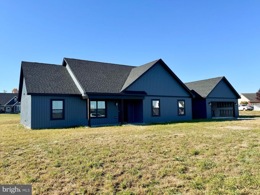 Located in the desirable Highland Estates subdivision, just beyond Petersburg's downtown city limits, this impressive new Ranch-style home occupies a serene corner lot. With 1500 square feet of meticulously designed living space, this 3-bedroom, 2-bathroom retreat offers a tranquil escape on 1.17 acres. Enjoy unparalleled peace of mind with a comprehensive one-year new home warranty from the builder, paired with modern, brand-new appliances. The heart of the home features an expansive kitchen and dining area, seamlessly connected to a spacious living area and two adaptable bonus rooms. The added benefit of a single-level floor plan eliminates stairs, ensuring easy living. Turn your vision of suburban serenity into a reality.