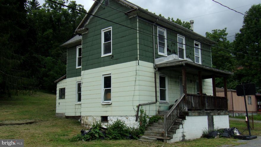 PROPERTY IS BEING SOLD "AS-IS" -CASH PURCHASE ONLY - MAIN LEVEL HAS LIV RM -DIN RM - KIT AND COULD BE A COMBO LAUNDRY RM AND BATH -THIS HOME IS IN NEED OF MAJOR REPAIRS - 3 BDRMS ON THE UPPER LEVEL - UTILITIES ARE AVAILABLE AT THE LOCTION