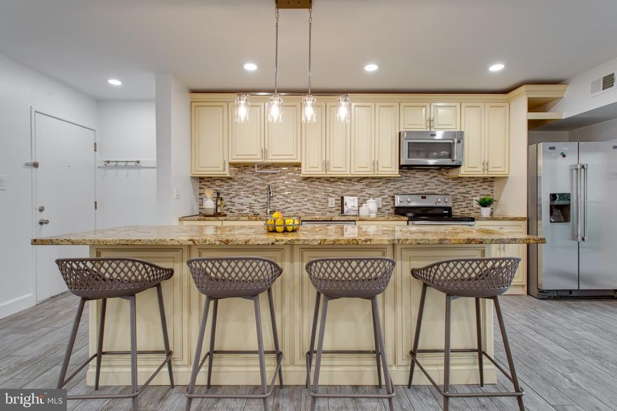 Welcome to this spacious and stylish 3-bedroom condo in Reston’s desirable Shadowood Community, featuring a private balcony with tranquil views of trees and direct access to scenic walking and biking trails. Thoughtfully updated and move-in ready, this home offers ceramic tile and luxury vinyl plank flooring throughout and fresh, modern paint tones that set a clean, inviting atmosphere.

The updated kitchen is outfitted with sleek stainless steel appliances, perfect for both everyday use and entertaining. One of the bedrooms has been intentionally opened up into the main living area to create a more specious feel—ideal for use as a home office or flexible living space. Prefer a traditional layout? The room can easily be enclosed again at the buyer’s request. The unit also comes with a storage space in the basement. 

As a resident of the Shadowood Community and part of the Reston Association, you'll enjoy a truly unparalleled lifestyle. In addition to Shadowood's convenient on-site management and inclusive condo fee—which covers electricity, heating, air conditioning, water, sewer, trash/recycling, and general maintenance—you'll gain access to over 40 master association amenities. These include multiple swimming pools, tennis courts, pickleball courts, miles of wooded trails, tot lots, picnic areas, pavilions, recreation fields, a campfire ring, and even polo fields.

Parking is easy with one assigned space and an additional unassigned spot. All of this just two miles from Reston Town Center and the Wiehle-Reston Metro station—making this an ideal spot for commuters and anyone who values comfort, convenience, and connection to nature.