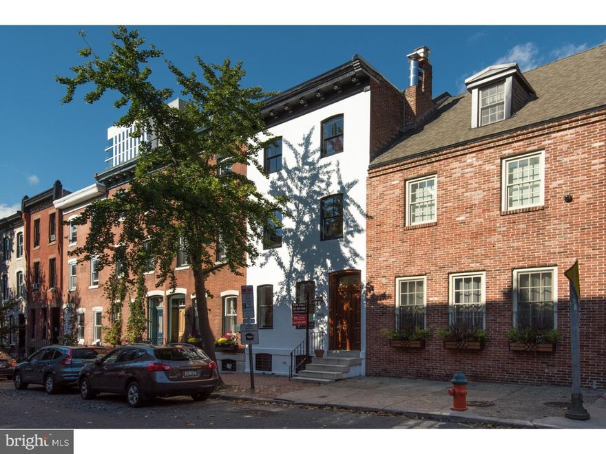 Showings begin at Open House Happy Hour Wed  Nov 1 5-7pm. This is the home you've been waiting all year for! Come see this gorgeous three-story home on one of the most desirable tree lined streets in Fitler Square! Located in the Greenfield Catchment, this 3 bed 3 full bath brick front has been completely renovated from top to bottom. All plumbing, electrical, roof, windows, doors, walls & HVAC have all been redone so you can live worry-free for years to come! Enter the front door to find an open concept living room with gas fireplace, dining area, and kitchen with gorgeous white cabinets, granite counters, and stainless appliances. The kitchens leads to the spacious & private brick paved garden area. On the second floor you will find two large bedrooms with tons of closet space serviced by a beautiful hall bath with stunning great & white modern finishes. The third floor is a complete classy master suite with a large bedroom, full bath with enlarged tile shower and a gorgeous white and marble double vanity. Off the bathroom you'll find a huge walk-in closet ready for your customization. 2nd & 3rd floors feature original random width oak floors. It doesn't end there! The basement is fully finished with a full bath and get this, it's a walk out! You'll find high ceiling, oversized baseboard, and lots of natural light throughout. As if all this isn't enough, the location cannot be beat! At the end of the block you will find the Schuykill River Park, dog run, and access to the trail. 10 year tax abatement has been applied for.