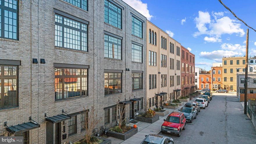 A rare offering in coveted Brewer’s Green, this expansive townhome delivers refined city living with scale, light, and luxury, beautifully balanced on a quiet residential street.
Built in 2018 and spanning over 2,600 square feet, the home’s generous 17-foot width creates a sense of openness rarely found in Baltimore townhomes. Ten-foot ceilings, oversized front and rear windows, and rich hardwood floors throughout set an elevated tone from the moment you enter, filling each level with natural light.
The main living level is designed for both everyday ease and effortless entertaining, featuring a spacious living and dining area anchored by a stunning, high-end kitchen. Here, premium GE Café line appliances, a large center island with seating, and thoughtfully selected finishes come together with both style and function in mind.
With four bedrooms, each offering its own ensuite bath, the layout provides exceptional privacy and flexibility for family, guests, or work-from-home living. Electronic shades, refined details, and impeccable finishes reflect a commitment to quality at every turn.
Crowning the home is an exceptional rooftop terrace providing an ideal retreat for morning coffee, evening gatherings, or simply enjoying the city skyline and waterfront views. A one-car garage adds everyday convenience without compromise.
Perfectly positioned near neighborhood shops, dining, fitness studios, and the scenic paths of Canton Waterfront Park, with quick access to I-95 and I-895, this home offers a lifestyle that feels both connected and quietly luxurious.
This is Brewer’s Green living at its finest; rarely available, beautifully executed, and ready to be enjoyed.