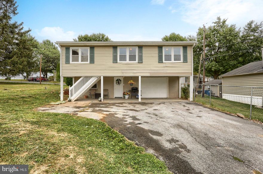 Welcome to this beautifully maintained 3-bedroom, 1.5-bath home nestled on a generous .74-acre flat corner lot, offering both space and potential. Inside on the upper level, you'll find a warm and inviting layout featuring a bright living area, a functional kitchen, 2 bedrooms and a full bathroom. The lower level holds an open living area, a 3rd bedroom, and a half bath, as well as a washer and dryer hook up spot. Outside, enjoy the expansive, level yard—perfect for gardening, recreation, or even future expansion. The corner lot provides additional privacy and easy access along with a fully fenced yard. Roof was replaced this year and a new septic system was installed last year!