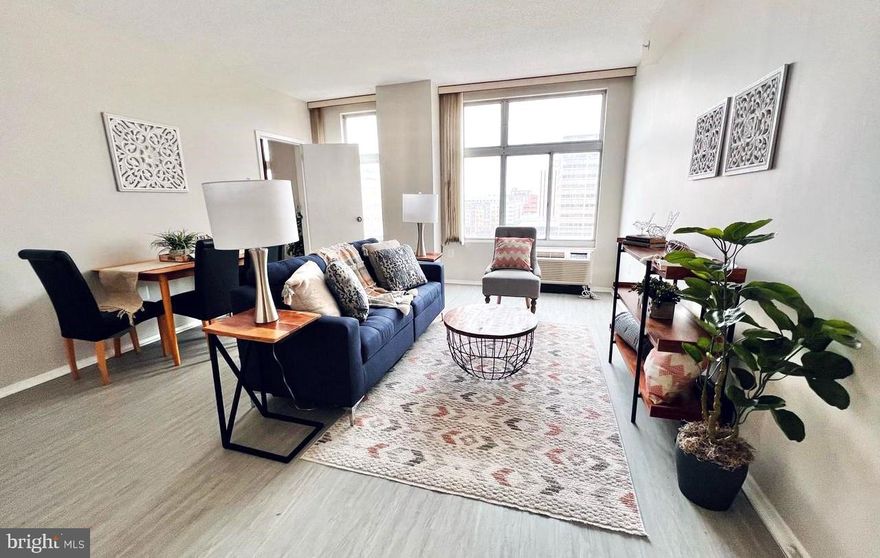 Back to Market-Buyer's financing fell through.   Discover this freshly painted exquisite two-bedroom, one-bath condo in the heart of downtown Towson. Experience hotel-like amenities, including a 24/7 concierge, heated outdoor pool, spacious gym, club room, WiFi-equipped library, and secure garage parking. Conveniently situated just minutes from Towson Town Center,  LA Fitness, and various shopping, dining, and recreational options. The master bedroom offers breathtaking views of the Towson skyline, complemented by ample natural light through large windows. Recent upgrades feature luxury vinyl plank and tile flooring, along with stainless steel appliances. The condo, located on the 8th floor for a lower residential living cost, boasts three heat pumps installed approximately five years ago, elegant white cabinets, and a quartz countertop. Enjoy the added advantage of a reduced condo fee due to its lower floor location. The monthly condo fee is $513.04, with an additional special assessment fee of $123/month starting from February 2023 and lasting for 13.5 years.