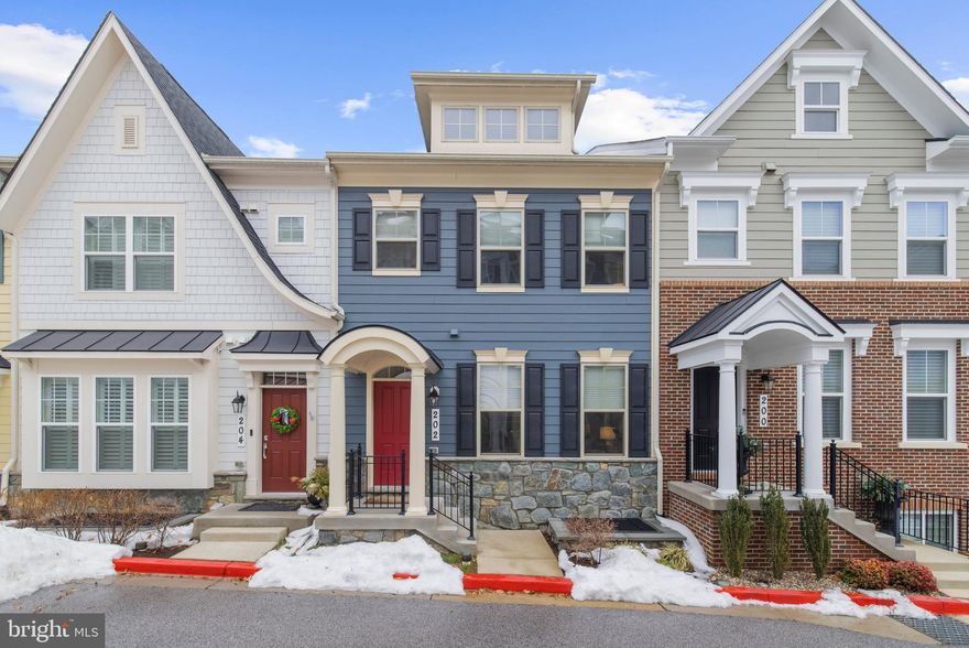 Tucked within the private enclave of Primrose Hill, 202 Landmesser Aly offers the best of Annapolis living in a home just 7 years old, truly showing like new construction. This residence features a welcoming entrance on the main living level, allowing you and your guests to step directly into the heart of the home.  The beautifully maintained interior includes 3 bedrooms, 2 full baths, and 2 half baths, plus a two-car garage with additional driveway parking.

Step inside to find warm wood floors throughout the main living spaces and a thoughtfully designed layout built for everyday ease. The main level is anchored by a gourmet kitchen, featuring quartz countertops, a herringbone subway-tile backsplash, an island with bar seating, a gas range, and table space for casual dining. Cozy up beside the striking indoor-outdoor gas fireplace, including a dramatic two-sided twilight feature that adds warmth and ambiance to both the interior living area and the deck, for effortless indoor-outdoor entertaining.

Upstairs, you will find all three bedrooms, upper-level laundry, and a hall bath with a tub. The spacious primary suite is a standout, featuring a walk-in closet and a spa-inspired bath with a walk-in shower, dual vanity, and private water closet. Ceiling fans, overhead lighting, and plush carpeting extend throughout all three bedrooms for added comfort.
 
A convenient mudroom nook with a built-in bench creates the perfect drop zone as you enter from the garage. The lower level features wood flooring and offers flexible space for an entertainment room, home office, or gym, and includes a half bath for added convenience.

Enjoy close proximity to downtown Annapolis and Eastport, with shopping, dining, and easy access to commuter routes. With nearby marinas for boating, waterfront parks, and recreation centers within walking distance, and the ability to bike into Eastport or downtown, this location delivers the Annapolis lifestyle you have been waiting for. Welcome Home!