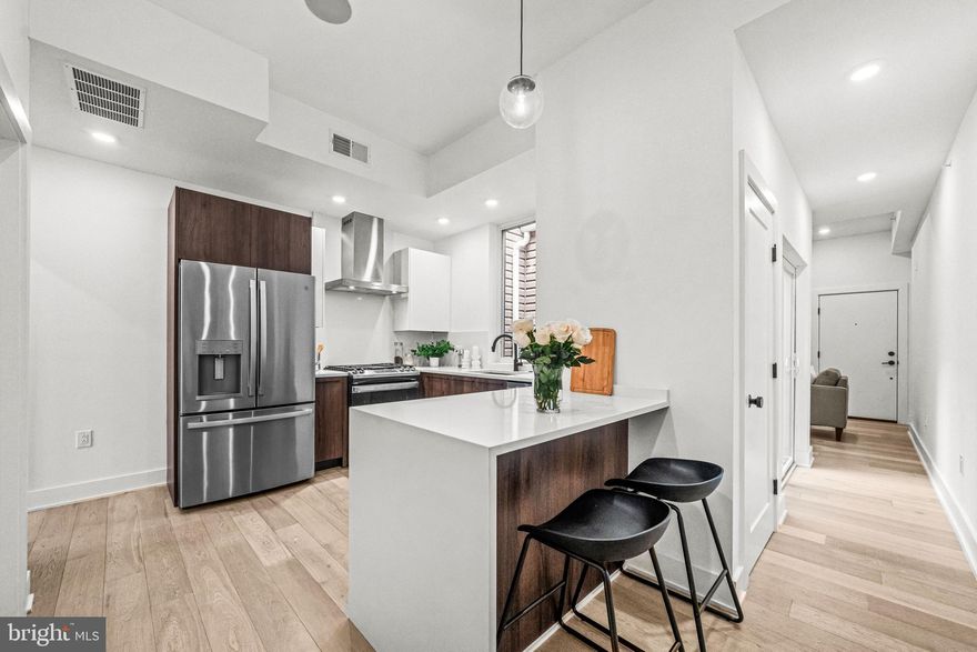 New Construction Condo in the heart Graduate Hospital with PARKING & roof deck with skyline views! Welcome to Unit 4 of a bespoke boutique condominium located on a beautiful tree-lined street in the heart of Graduate Hospital. This brand-new 2 bed, 2 bath condo offers luxury city living with 1-car parking included and roof deck featuring unobstructed Center City skyline views. The unit boasts modern finishes throughout, including a natural light–filled atrium, Porcelanosa kitchen and vanities, Delta fixtures, GE appliances, Light sand-tone engineered hardwood flooring, California Closets systems maximizing ample storage, and an in-unit washer and dryer. Enjoy a prime location that is walkable to Rittenhouse Square, Center City, Schuylkill River Park, Target, Sprouts, and popular local spots like Sidecar Bar & Grille and Loco Pez. Easy access to major highways, bridges, and Locust Point makes commuting simple and convenient. This is a rare opportunity to own a beautifully designed new construction condo with parking in one of Philadelphia’s most desirable neighborhoods. 7 Years Remaining on Tax Abatement!