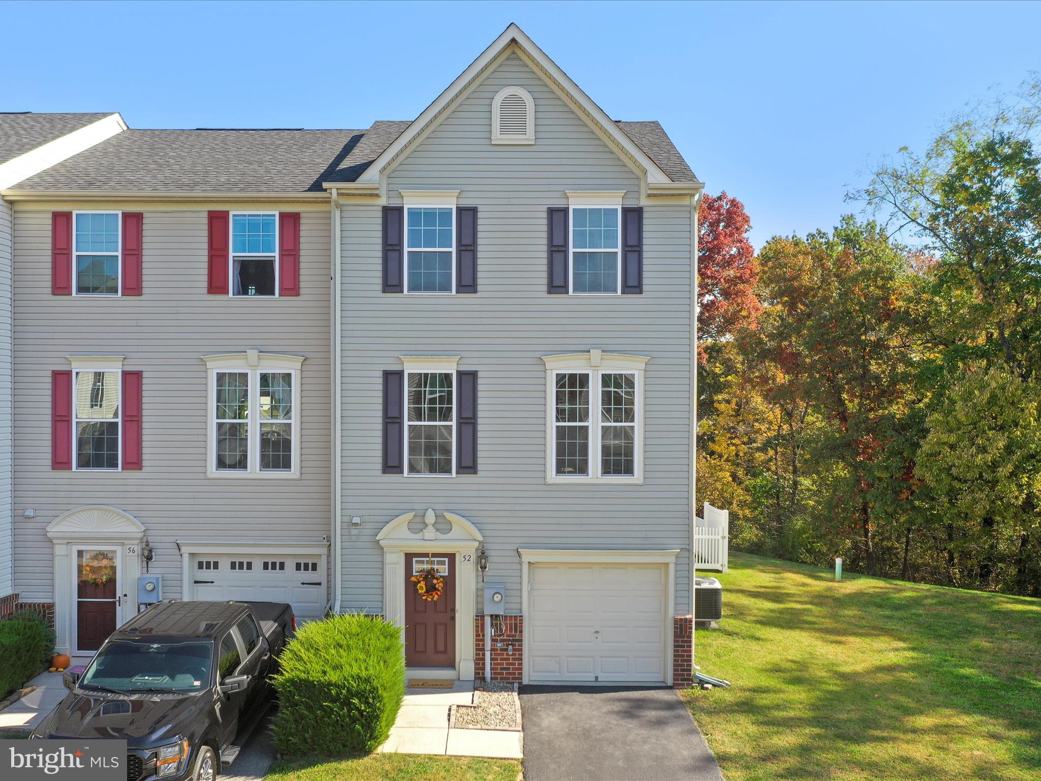 Welcome Home to this beautifully maintained end-unit townhome in the Brookfield community! Featuring 3 beds, 2.5 baths. Enter through the inviting foyer that leads to a full daylight basement. Versatile living area to use as a recreation room, gym or home office. Make your way to the upper main level with gleaming hardwood flooring. Spacious kitchen/dining boasts a large island, perfect for casual dining or entertaining, pantry, and plenty of cabinet space. It opens up to a cozy living room. All bedrooms on third level with convenient laundry in the hall. Primary bedroom is complete with a walk-in closet and en suite with double sinks and walk-in shower. Step out to the back deck that overlooks the spacious fenced-in backyard, great for outdoor enjoyment. HOA provides private picnic areas, river access for boating, kayaking, fishing, and exploring nature on the Potomac River. Close to I-81 and Route 9 for the work commuters. Don't miss your chance to make this yours! Schedule your showing today!