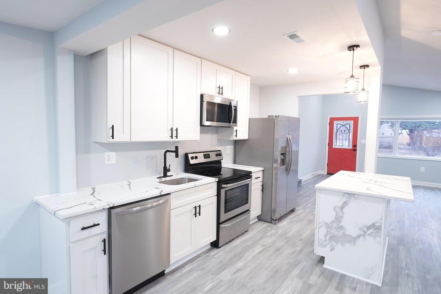 This tastefully totally remodeled home offers modern comfort and refined style across three generously sized levels. The sun-filled main level showcases an open living and dining space that seamlessly connects to a contemporary kitchen featuring white cabinetry, new quartz countertops, and new stainless-steel appliances. Upstairs, you’ll find three bedrooms and one and a half bathrooms, complemented by brand-new flooring throughout. Recent improvements include a NEW roof, NEW HVAC system, NEW doors, providing added efficiency and long-term peace of mind. The fully finished lower level delivers exceptional versatility with an extra room, a full bathroom, and a spacious living area—ideal for entertaining guests, working remotely, or unwinding. The home also includes a nicely sized carport, and flat, spacious backyard perfect for entertaining. With its thoughtful renovations, turnkey condition, and flexible floor plan, this home is ready to welcome its next owners.