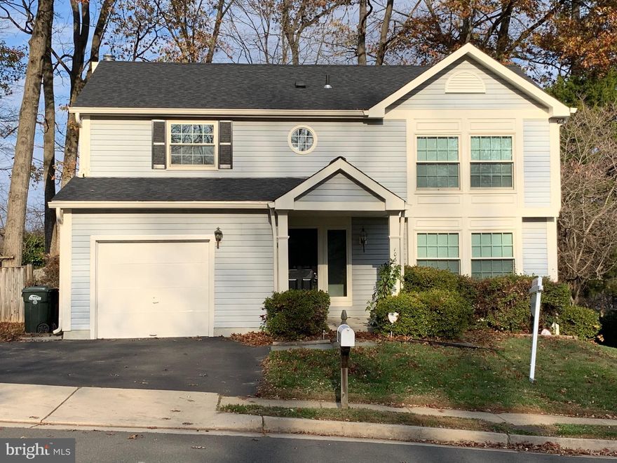 Note:  Assumable 2.75% VA loan that will enable you to save thousands a year in interest payments.  Freshly painted and move-in ready Colonial in great Family orientated and dog friendly neighborhood..  Hardwood floors throughout the first and second floor.  Updated kitchen with granite countertops that opens to a charming family room with wood burning fireplace.  Large dining and living room with lots of light.  A half bath rounds out the first floor.  Upstairs are four bedrooms and two full baths.   Each bedroom has hard wood floors.  Master bedroom has a large walk-in-closet, dressing area, and full bath.  The basement is partially finished and provides ample space for a playroom for the kids or an office for adults, with a substantial unfinished area available  for storage.   Large private fenced-in back yard is perfect for a summertime BBQ or private play area for kids.   Enjoy the available amenities like access to the community pool, tennis, and basketball courts.  Close to George Mason’s campus and  shopping.  Convenient to VRE and other major commuter options to the Pentagon and/or DC.