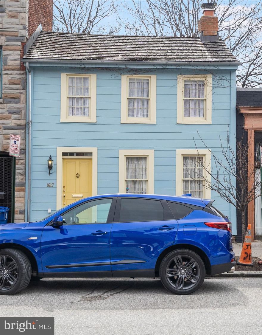 Your country cottage in the city, combining quaint charm with the best of urban living. Perhaps the oldest,and largest, surviving wooden house in Baltimore, this home was built in 1787 and completely restored in 2011 with additional improvements in 2014. Once the home of Nicolas Leeke, a schoolmaster, and later of the famous privateer of the war of 1812, Captain Thomas Boyle, this house was awarded The Preserve America Steward Award, signed by Michelle Obama, in 2012. Step through the front door of this charming, light filled home, and discover the historic entrance stair hall. The cozy living room features a 19th century decorative mirrored fireplace. The open kitchen and dining room floor plan adds a modern feel to this period home. The updated kitchen has marble counters and custom cabinetry. The first floor powder room is right off the kitchen. Step through the back door onto a landscaped brick patio with plenty of room to entertain. The second floor master bedroom includes a built-in dresser with marble top. A second floor full bath has a skylight and built-in storage under a marble counter. The laundry and a generous walk in closet are located in the center of the home. The second bedroom is currently used as a sitting room. A third room presently functions as an office, and could be used nursery or sewing room. This home is ideally located just steps from the Fell's Point waterfront with its many dining and entertainment options, and is within easy walking distance to Harbor East and the new flagship Whole Foods market. The new North Market food hall and South Market Choptank crab house are just around the corner, while the elegant new Pendry Hotel is three blocks away. The home has a 10 year CHAP tax credit that commenced in May 2014.