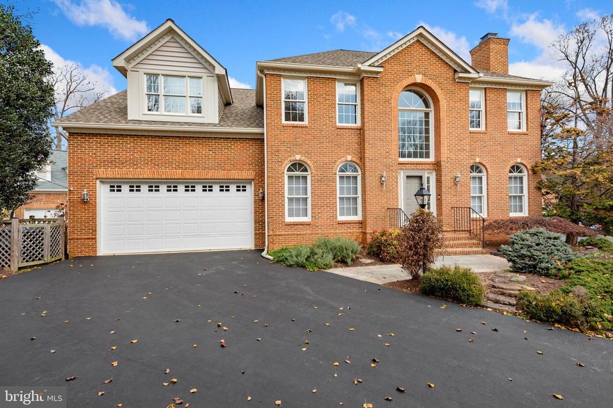 Astonishing Single-Family Home.  convenient Fairfax County location,  Cul-de-sac  front Brick with over 5300 Sq Ft, 5 large bedrooms, and 5 full baths. The main level features a grand 2 story foyer entrance, formal dining room, formal living room with gas fireplace, beautiful family room with another fireplace, stunning top of the line chef's kitchen with stainless-steel appliances, granite countertops,  island, Kraft Maid slow-close cherry cabinets/drawers. huge vaulted ceiling sunroom/breakfast area, skylights with remote control shades. leading to a 28X16 trex deck with accent lighting and stairs to lower level patio. Main level also has extra rooms that can be used as  Office/ study.   and hardwood floors throughout the entire main and upper levels. Upper level has a huge grand master suite, with a sitting area and a gas fireplace, leading to a Juliet balcony for additional outdoor space. Upper floor is finished with 3 other spacious rooms. Lower level has a fully finished walkout basement with an extra 5th bedroom and an additional den/study. Basement features a spacious rec room with a wet bar. Moving outdoors, the private back yard with custom patio and deck is perfect for entertaining. Yard is complete. This area is perfect for families and has prestigious local schools. Lower level boasts a walkout rec room, wet bar, entertainment/activity space with step up stage, separate dining or game area, separate workout area, large 5th bedroom, full bath and hobby/storage room. French door walkout to extensive 3-level Techno-Bloc patio with retaining wall and raised planters*