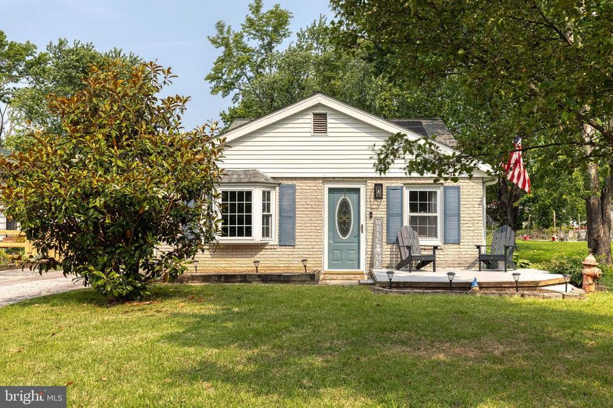 Welcome to this beautiful 3 bedroom, 2.5 bathroom split-level home in sought-after Oliver Beach! Bright living room features vinyl plank flooring and large windows. The 2024 renovated kitchen shines with stainless steel appliances, quartz countertops, glass tile backsplash, refinished cabinetry, recessed lighting, ceiling fan, bay window, built-in desk area, and easy access to the side yard and dining space. Upper level offers a primary bedroom with hardwood floors and en-suite access to an updated bath with walk-in stall shower, plus two additional bedrooms and a second full bath with tiled tub/shower and modern vanity. Fully finished lower level includes a spacious family room with vinyl flooring, recessed lighting, backyard access, plus a half bath and laundry area. Enjoy outdoor living with a large yard, stone patio with hot tub, gravel fire pit area, and a detached 2-car heated (wood-burning stove) garage. Additional updates include new heat pump (2024) and vinyl flooring (2020). A move-in ready home with great indoor and outdoor space!