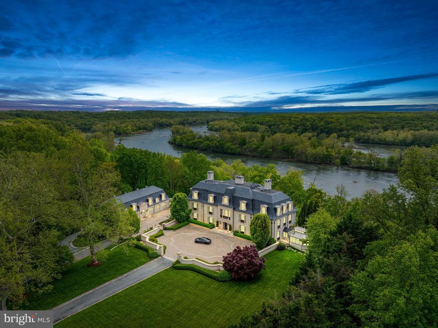LUXURY PROPERTY AUCTION: 5–18 DECEMBER.

Accepting Starting Bids Through 4 December.

Starting Bids Expected Between $7.5M-$11.5M.


Earn an incentive by 4 December.

Anchored along the Potomac River on over 13 private acres, this magnificent French Chateau-inspired estate exemplifies the pinnacle of architectural refinement and luxurious living. Approached by a half-mile tree-lined drive beyond an arched gate, the residence unveils breathtaking panoramas of the river and protected parkland. A masterful collaboration between architect John Ike, designer Geoffrey Bradfield, and Horizon Builders, this limestone and slate masterpiece comprises over 40,000 square feet across three meticulously crafted structures. The 25,000-square-foot main residence features coffered ceilings, floor-to-ceiling windows, and imported stone detailing throughout four levels. The entertainment-grade lower level showcases a professional theater, clubroom with magnificent bar, and wine cellar rivaling the finest restaurants. A thoughtfully designed three-level guesthouse with 11 garage bays transforms effortlessly from automotive showroom to glamorous event space, while a 4,500-square-foot staff residence ensures seamless property management. Every amenity speaks to uncompromising luxury—commercial chef's kitchen, elevator access, heated pool, generator backup, automated snow-melt systems, and reverse osmosis water throughout. Remarkably, sale proceeds benefit The American Cancer Society, making this acquisition an extraordinary legacy opportunity.