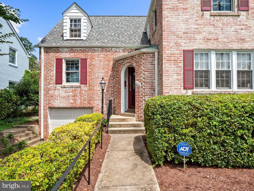 Welcome to this elegantly updated solid brick home with an attached garage in Chevy Chase, just blocks from everything downtown Bethesda has to offer. The main level features a spacious living room complete with a wood-burning fireplace and a large bay window overlooking the landscaped front yard. From the living room, enter an enclosed sun porch with a ceiling fan - perfect for enjoying that morning cup of coffee or afternoon book. The updated kitchen features silestone counters, ample cabinetry including a large pantry, stainless steel appliances, and a breakfast bar. The kitchen is open to the formal dining room. From the kitchen, walk out to the charming, landscaped backyard oasis. There is a main floor bedroom with an ensuite bath, currently used as a den. The second level landing leads to the comfortable owner’s suite, which includes two thoughtfully designed walk-in closets, and an attached full bath with a stackable washer and dryer. One more generous bedroom and a full hall bath complete the third level. The fully finished lower level includes a family room, a 1/4 bath, laundry, and utility room with access to the attached 1-car garage and the backyard. With a Walk Score of 96, this perfectly located home is just minutes from Bethesda Row, the Metro, restaurants, the farmer’s market, shopping, and more!