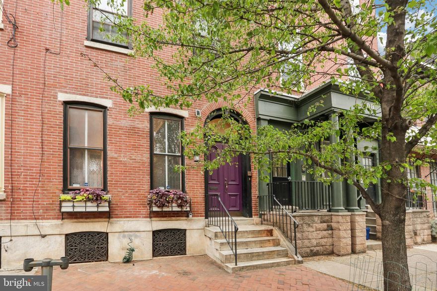 Nestled just a block from the vibrant Fitler Square, this grand single-family home offers an exceptional opportunity in a sought-after neighborhood. Step inside to discover a wealth of original architectural details, including impressively large pocket doors, a welcoming foyer, and striking random-width heart pine floors throughout (no carpeting). The residence boasts a formal parlor perfect for entertaining, a spacious formal dining room, and a handsome wood-paneled library ideal for work or relaxation. The eat-in kitchen provides a more casual dining space. Upstairs, you'll find four well-proportioned bedrooms. High ceilings enhance the sense of space and light throughout the home.  Enjoy unparalleled walkability with easy access to Fitler Square, Rittenhouse Square, and the University of Pennsylvania. This prime location offers convenience to renowned restaurants, shops, parks, and cultural attractions. While this home exudes character and charm, it presents a wonderful opportunity for a discerning buyer to personalize and update to their taste. Don't miss your chance to own a piece of Philadelphia history in an exceptional setting.