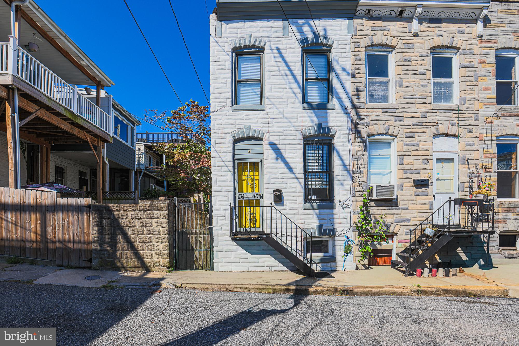 Location, location, location!! Look no further. Tucked away on a serene street, this charming end of unit rowhouse offers a peaceful retreat near Patterson Park. You really can have it all. This wonderful home checks all the boxes and is ready to move in. Sun filled rowhouse, that has been updated, recently painted and move-in-ready! 
Abundant natural light streams through bathing the entire home in gorgeous light. 
Main level offers an updated kitchen and a full bathroom. The modernized kitchen is spacious with plenty of cabinetry and counterspace (including an island). The back door from the kitchen leads to the intimate backyard, ready to sip coffee or get grilling. 
The living room is cozy, warm and inviting. Perfect for hanging out with friends, watching sporting events, as well as game nights or hanging out on the couch watching your favorite movies. 
Upper level includes 2 bedrooms and a full bathroom.  
The basement is ready to be a man cave, playroom, craft area, workout space, whatever you need.
Meticulously cared for this home embodies a perfect blend of thoughtful design, serene surroundings, and contemporary convenience, promising a haven where every detail contributes to a life well-lived. It is waiting for its new owner!