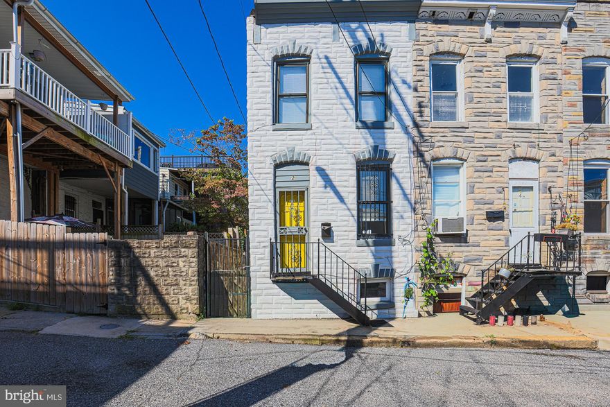 Location, location, location!! Look no further. Tucked away on a serene street, this charming end of unit rowhouse offers a peaceful retreat near Patterson Park. You really can have it all. This wonderful home checks all the boxes and is ready to move in. Sun filled rowhouse, that has been updated, recently painted and move-in-ready! 
Abundant natural light streams through bathing the entire home in gorgeous light. 
Main level offers an updated kitchen and a full bathroom. The modernized kitchen is spacious with plenty of cabinetry and counterspace (including an island). The back door from the kitchen leads to the intimate backyard, ready to sip coffee or get grilling. 
The living room is cozy, warm and inviting. Perfect for hanging out with friends, watching sporting events, as well as game nights or hanging out on the couch watching your favorite movies. 
Upper level includes 2 bedrooms and a full bathroom.  
The basement is ready to be a man cave, playroom, craft area, workout space, whatever you need.
Meticulously cared for this home embodies a perfect blend of thoughtful design, serene surroundings, and contemporary convenience, promising a haven where every detail contributes to a life well-lived. It is waiting for its new owner!