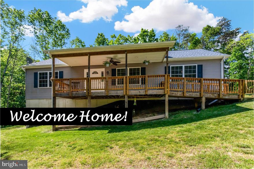 ABSOLUTELY PERFECT and in the HEART of everything!  Nestled on 1.21 acres this raised rambler is only 5 years young.  Cozy front porch with ramp access.   HUGE kitchen with ample cabinets and counter space.  Nice sized peninsula with breakfast bar.  Stainless appliances.  Off the kitchen is a laundry/mud room with outside access.  Separate dining area, prefect for a farm style table.  Sliding glass door to your future deck.  Open concept to the spacious family room.  Great spilt-bedroom plan, with large primary bedroom with private bath.  Nice sized secondary bedrooms and hall bath.  Walk-up stairs to a floored unfinished attic with tons of potential, great area for storage or future office/playroom, lots of options!  Then even more possibilities as you head to the basement, SO MUCH SPACE with almost 1500 sq feet.  Walk-out level and full sized window.  All this sitting on a park-like lot with mature trees, picnic area and even a creek that runs through.  Great soil in the veggie garden ready for your plants.  Not to mention a large driveway for 6+ cars.  NO HOA!  This is the perfect oasis, yet less than a 1/2 mile to Wegmans shopping area. Gainesville Promenade and Downtown Haymarket are just a short drive.  Easy access to commuter routes.  Location x 3!