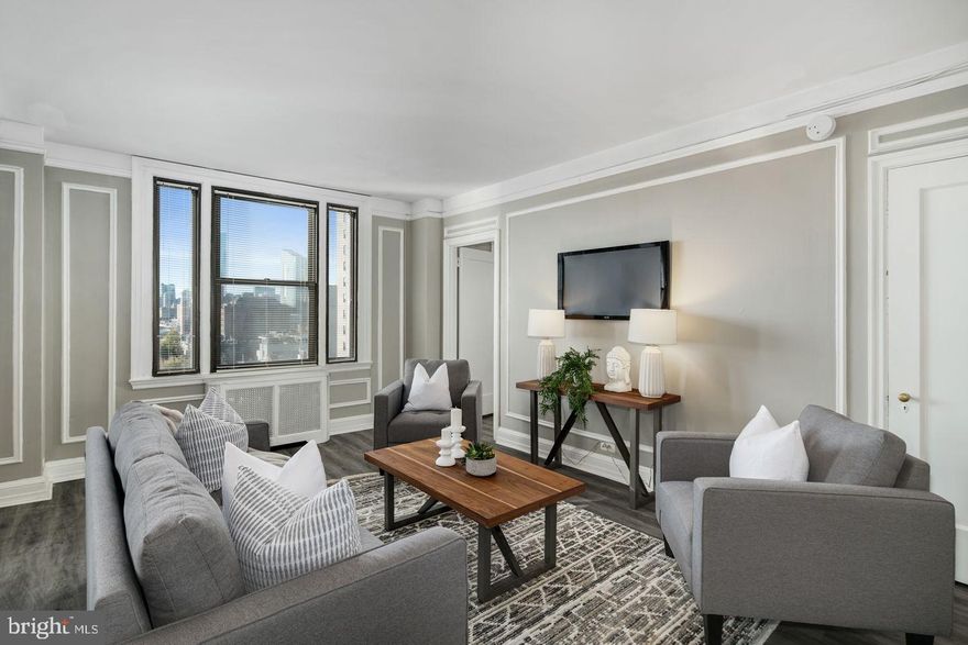 Bright and sunny two bedroom, three bathroom home with new floors throughout, just steps away from Rittenhouse Square! The home features a generously combined living/dining room that showcases windows beaming with natural light and provides access to a walk-in closet for additional storage space. Adjacent to the living/dining room, is a beautifully appointed, spacious kitchen featuring grey and glass cabinetry and white appliances. There is a washer/dryer located next to the kitchen. The primary bedroom features a large walk-in closet and an ensuite bathroom with a stall shower. There is a second bedroom that has a wall closet and enjoys use of a nearby full hall bathroom.    The Carlyle is a pet-friendly, doorman building only one block from Rittenhouse Square. Rent includes the security of a 24-hour doorman and use of the building's state-of-the-art gym. Tenants are responsible for paying all utilities.