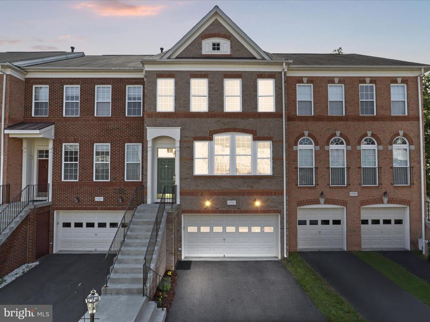 OPEN HOUSE SATURDAY 2-4PM****Stunning Luxury Townhome Backing to Trees – Prime Ashburn Location!  Welcome to this beautifully upgraded 4-bedroom, 3.5-bath townhome offering over 2,500 square feet across three fully finished levels. Ideally situated just minutes from the Ashburn Metro, this home backs to serene trees and a spacious common area, providing privacy and a natural backdrop.  Enjoy a host of premium features including a three-level bump-out, gleaming hardwood floors on the main level, 9-foot ceilings, and elegant upgraded trim. The chef’s kitchen is outfitted with Corian countertops, 42” cabinetry, and flows into a bright sunroom that opens to a rear deck—perfect for entertaining.  The inviting lower level features a family room that centers around a cozy gas fireplace,  a true 4th bedroom and a full bath.  The spacious primary suite offers a private sitting area and a luxurious en-suite bath. Outside, a fenced backyard boasts a stamped concrete patio for low-maintenance enjoyment.  Additional highlights include a new 50-year roof, 2020 HVAC system, fresh paint, and newer appliances. Located in the highly rated Briar Woods High School pyramid, this home blends comfort, convenience, and style in one exceptional package