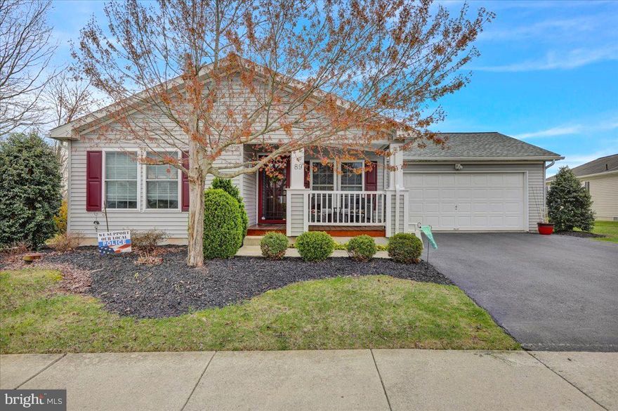 Step into luxury and comfort with this beautifully crafted Home situated in the highly desirable 55+ community of Douglass Village.  Boasting 3 bedrooms, 2 full baths, and a spacious kitchen,  this open floor plan and large family room w/ gas fireplace provides an ideal layout for gatherings with friends and family.   It offers the perfect blend of functionality and style.  Relax on the large covered front porch or entertain guests on your Covered stamped concrete Patio.   With a 1-year-old roof and low taxes, this property provides peace of mind and affordability. Complete with a 2-car garage and well thought out floor plan, this home is an oasis for those seeking a serene retirement retreat.