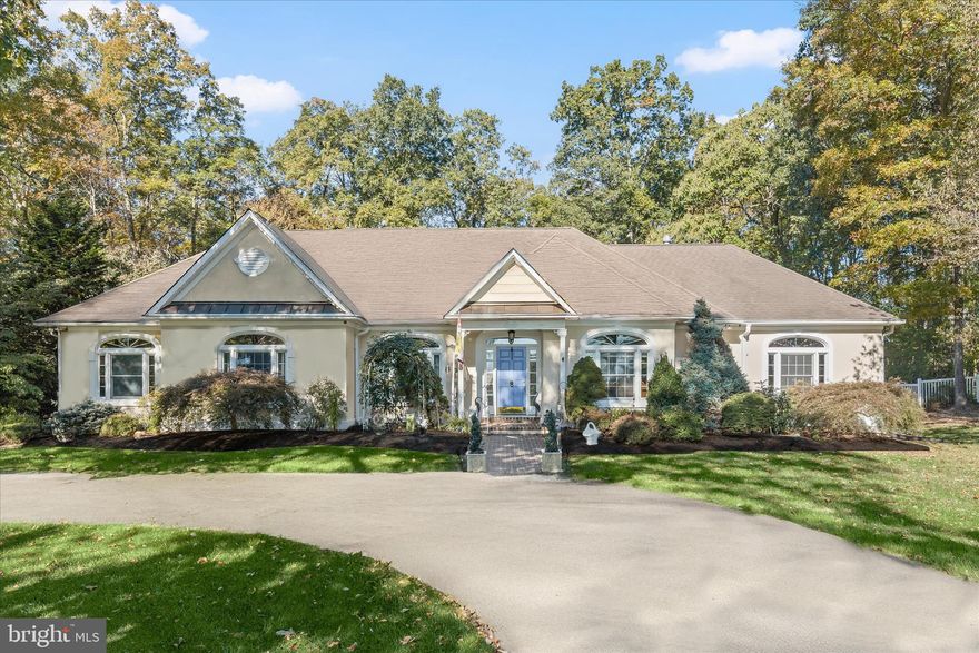 Experience a peaceful lifestyle in this custom five-bedroom, four and a half bath home set on a private four-acre lot in the sought-after Greenside Vista community of Parkton. A long private driveway leads to partially wooded, landscaped grounds that create an immediate sense of privacy and arrival.
Inside, the high-ceilinged foyer opens to a study with hardwood flooring and crown molding, while the pillared dining room provides an inviting space for both everyday meals and special gatherings. The step-down living room is highlighted by a soaring cathedral ceiling, rich hardwood floors, a striking accent wall, recessed lighting, an alcove area, and a cozy corner gas fireplace.
The eat-in kitchen is well-appointed with granite countertops, 42 inch cabinetry, stainless steel appliances, a double wall oven, and a pantry. Casual meals can be enjoyed at the peninsula island or in the breakfast nook, which overlooks the paver patio and offers views of mature trees, a fenced lawn, and thoughtful landscaping. Just beyond, the sunroom features a cathedral ceiling with skylights that fill the space with natural light.
Single-level living continues in the primary bedroom suite, which includes a tray ceiling, hardwood floors, crown molding, a two-sided walk-in closet, and a gas fireplace that adds warmth and ambiance. The spacious primary bath offers a jetted soaking tub, dual vanity, and a walk-in shower enclosed by frameless glass. The shower is finished with ceramic tile, decorative inlay, and dual shower heads, creating a calm, spa-like setting.
This wing of the home also includes two additional bedroom suites with en suite baths and crown molding, along with a conveniently located powder room. The opposite wing offers two more main-level bedrooms with Palladian-style windows, a full bath, a laundry room, and access to the finished three car garage.
Recent updates add to the value and peace of mind, including the roof installed in 2009, front HVAC system replaced in 2023, rear AC updated in 2020, whole house generator added in 2023, septic pumped in 2025, fresh interior paint in 2025, and a 25’ by 10 ‘shed with electric. If you are seeking an upscale country setting with space, privacy, and thoughtful design, this home offers an exceptional opportunity.


Note:  Select interior photos have been virtually staged.