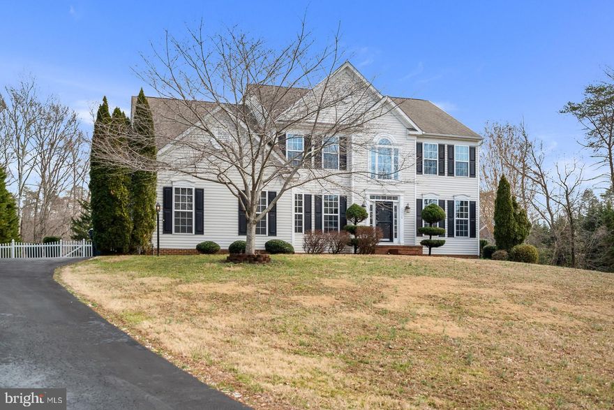 Spacious, Sun filled & Sparkling clean! This home features a gorgeous grand 2 story foyer,and hardwood flooring throughout the main level. Gourmet kitchen with granite counter tops and stainless steel appliances. Separate formal dining, living room and Office/study. Open family room w/ gas fireplace off kitchen. A dual staircase leads you upstairs to the master master suite with cathedral ceilings and large master bath with separate soaking tub, 2 additional spacious bedrooms, a full bath and laundry room. Huge unfinished basement with lots of potential for extra living space or storage. Fenced backyard offers a park-like setting with lovely shaded patio and shed. Maintained to perfection and ready for you to move right in!