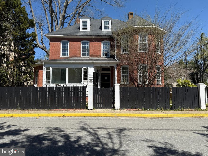 Investor or rehab opportunity!  Step back in time with this grand 1870 brick residence on a corner lot in the heart of Princess Anne’s treasured Historic District. A rare late-19th century find, this three-level home is rich with period detail—formal living and den spaces with fireplaces, ceiling medallions with chandeliers, and timeless brick accent. Though currently uninhabitable, it’s a prime investment or full restoration opportunity. The private, fenced yard with patio offers space to unwind or reimagine. Just a stroll from the Manokin River Park and the storied Boxwood Garden, which has graced the area since the early 1800s. Historic bones, high potential—waiting for the next chapter to be written. Property being sold as-is, where-is.